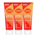 Three orange tubes of body wash in the scent Clean Tangerine