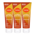 Three orange tubes of body wash in the scent Toasted Coconut
