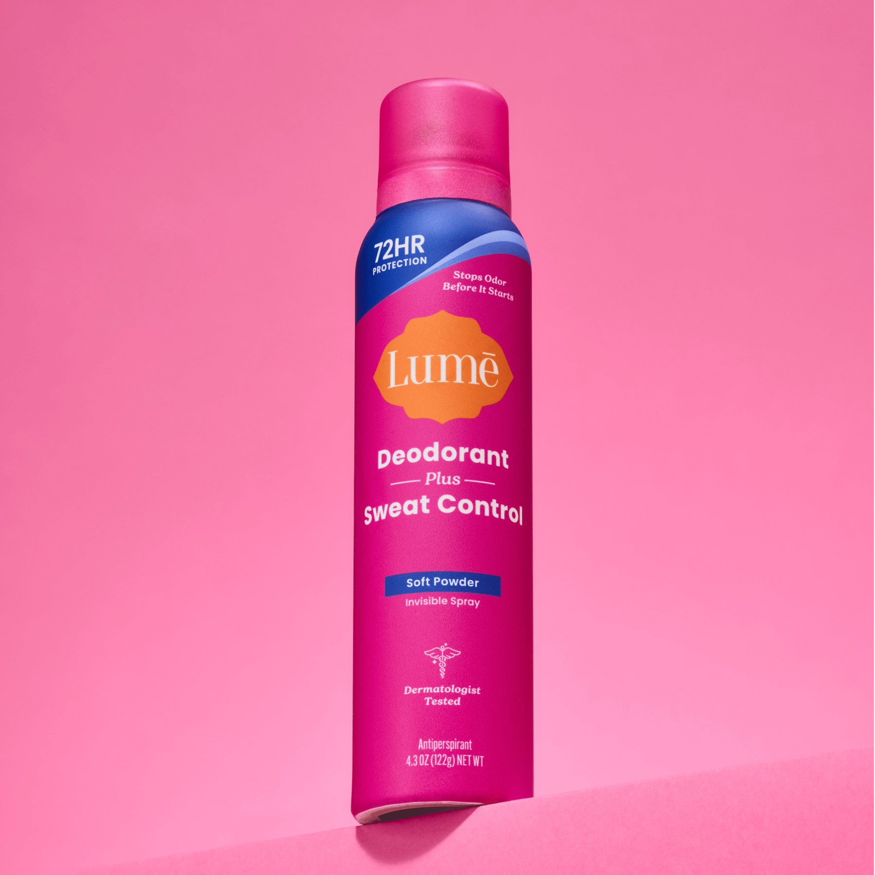 A can of Lume spray deodorant plus sweat control in front of a pink backdrop.