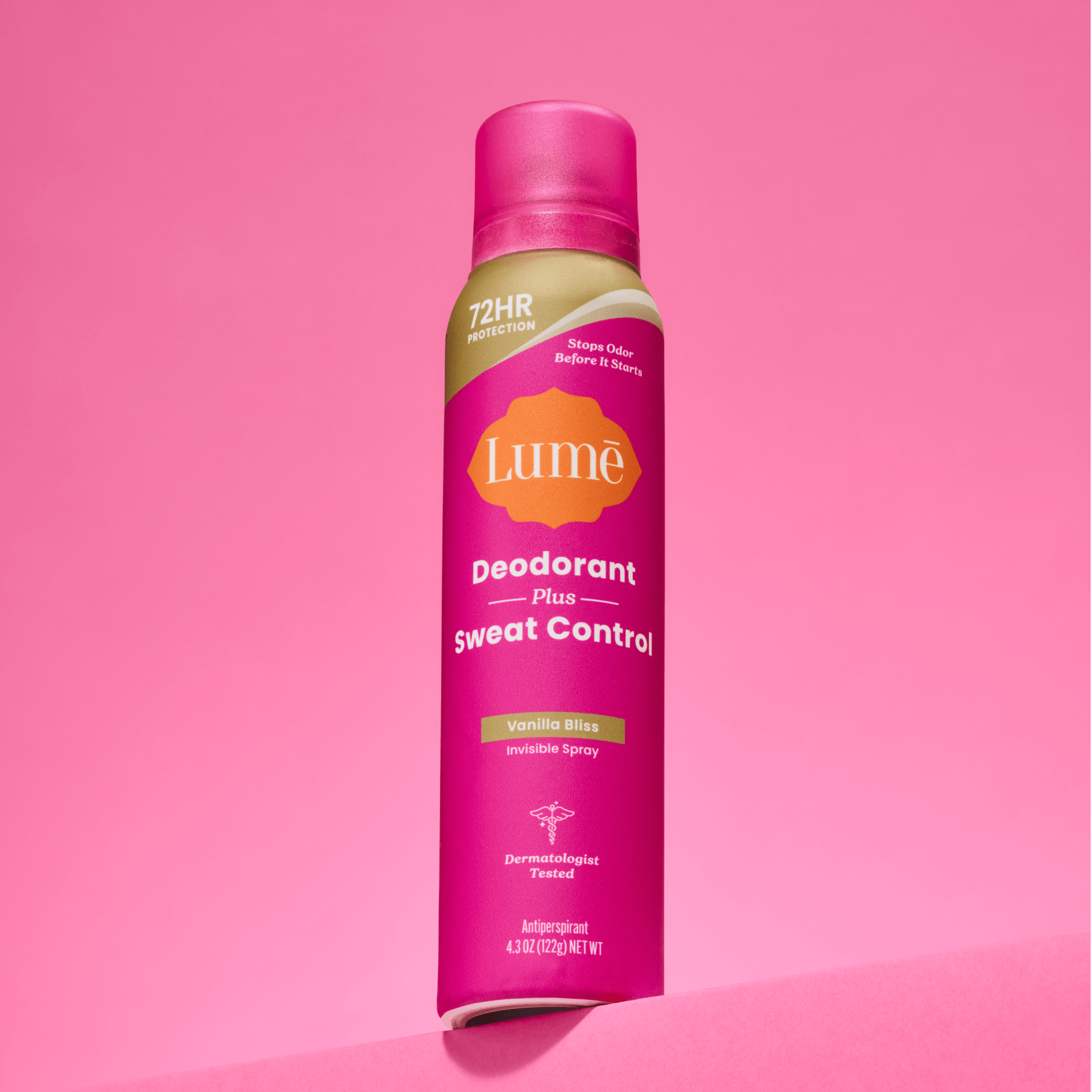 A can of Lume spray deodorant plus sweat control in front a of a pink backdrop.
